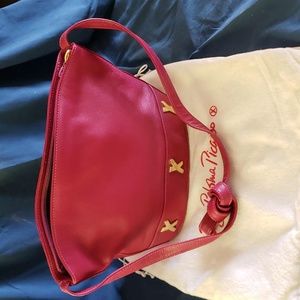Leather Paloma Picasso handbag in fuchsia.